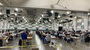 About 100 York County employees open and prepare mail ballots for counting after 8 p.m. Tuesday.