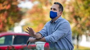 Jonathan Kassa, the Democratic nominee for a state House seat in Montgomery County, talks to a voter in North Wales, Pa., on Oct. 7. The district held by incumbent Republican Rep. Todd Stephens is one Democrats hope will help them flip control of the chamber.
