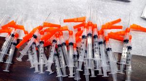 Syringes containing vaccine stand at the ready for members of the public to get the vaccine administered to them in the Sullivan County Elementary School in Laporte Bourgh Sullivan County Pennsylvania     Fred Adams/for Spotlight PA  1-29-21