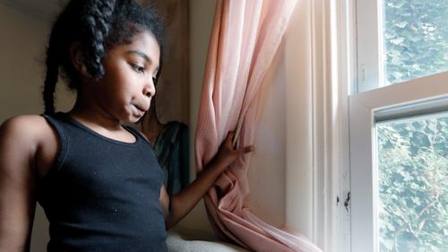 Jasmine Pennington's daughter Nylah Green, 9, pulls a bedroom curtain back revealing mold growing around the window in their Philadelphia rental unit. Jasmine Pennington's daughter Nylah Green, 9, pulls a bedroom curtain back revealing mold growing around the window in their Philadelphia rental unit.