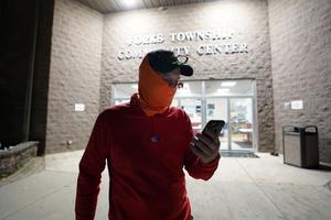 Edward Holley, of Forks Township, talks to friends on the phone after being the last person to vote at Forks Township Community Center on Nov. 3, 2020, in Forks Township, Northampton County, Pennsylvania. Edward Holley, of Forks Township, talks to friends on the phone after being the last person to vote at Forks Township Community Center on Nov. 3, 2020, in Forks Township, Northampton County, Pennsylvania.