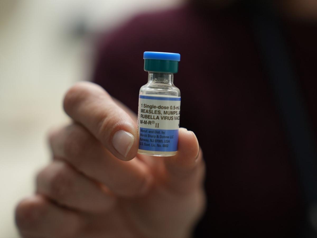 Photo: spotlightpa.org Dr. Jessica Early holds a vial of the combination measles, mumps and rubella vaccine at Prisma Health Pediatrics in Greer