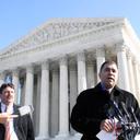 Citizens United President David Bossie (right) meets with reporters outside the U.S. Supreme Court.