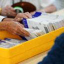 Workers sort mail ballots on primary Election Day 2024 at Northampton County Courthouse in Easton, Pennsylvania.