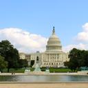 A summer view of the Capitol Reflecting Pool, Grant Memorial and U.S. Capitol Building.