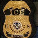 A federal agent wears an Immigration and Customs Enforcement badge in New York, June 10, 2025.