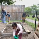 Diana McGuire leads her 4-year-old son Noah by the hand across the playground at St. Mary's Early Childhood Center in Indianapolis, Ind., May 13, 2026.