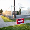 A “vote here” sign outside a polling place.