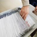 Mail ballots are sorted and counted by workers on Election Day in 2020.