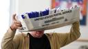 Workers sort mail ballots on Nov. 5, 2024, at Northampton County Courthouse in Easton, Pennsylvania.