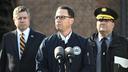 Gov. Josh Shapiro (center) is flanked by Dauphin County DA Fran Chardo (left) and Colonel Christopher Paris of the State Police.
