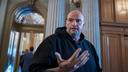 U.S. Sen. John Fetterman (D., Pa.) talks to reporters outside the chamber at the Capitol in Washington, March 13, 2025.