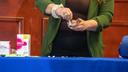 A person demonstrates how to use drug test strips.