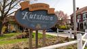 A sign for the borough of Kutztown that says ‘ a most agreeable town’ in faded letters