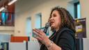 Maria-Manautou-Matos speaks into a microphone.