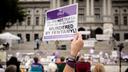 People gather on the steps of the Pennsylvania State Capitol in Harrisburg to honor lives lost to addiction during 2021's Overdose Awareness & Memorial Day.