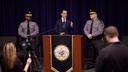 Pennsylvania Governor Josh Shapiro speaking at a press conference while flanked by state police.