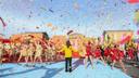 Confetti flies through the air during the opening number of Philadelphia's 2021 Thanksgiving Day Parade.