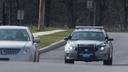A State Police patrol car drives near Commerce Street in Carlisle, Pa.