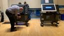 An election worker in Philadelphia, Pennsylvania examines an ExpressVoteXL voting machine during the 2022 primary.