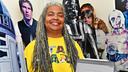Author Patricia Jackson poses with Star Wars memorabilia, including life-size character cutouts.