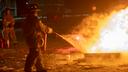 A firefighter puts out a fire during a training class.