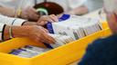 Workers sort mail ballots on primary Election Day 2024 at Northampton County Courthouse in Easton, Pennsylvania.