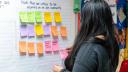 A woman in Berks county puts up a Post It note listing issues critical to her community