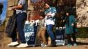 Voters walk past “Vote Here” signs in Pittsburgh’s Squirrel Hill neighborhood on Nov. 5, 2024.