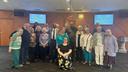 Mandy Mastros (center) surrounded by a group of Lancaster Moravian Church congregants.