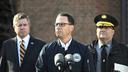 Gov. Josh Shapiro (center) is flanked by Dauphin County DA Fran Chardo (left) and Colonel Christopher Paris of the State Police