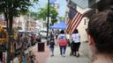 People walking the business district in Zelienople, Butler County, PA.