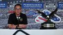 Gov. Josh Shapiro talks to the media prior to a NASCAR Cup Series auto race at Pocono Raceway.