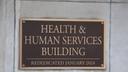 A placard outside the Pennsylvania Health & Human Services building in Harrisburg.