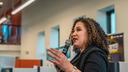 Maria-Manautou-Matos speaks into a microphone.