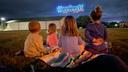 Children watch the inaugural Goose Day drone light show in downtown Lewistown in 2023.