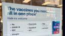 A flyer advertising vaccine services outside a CVS in Downtown Pittsburgh.