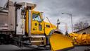 A PennDOT snow plow in a parking lot