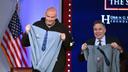 Democratic Sen. John Fetterman (left) and Republican Sen. Dave McCormick of Pennsylvania display hoodies presented by the Edward M. Kennedy Institute for the United States Senate after participating in a debate Monday, June 2, 2025 in Boston.