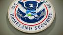 The Department of Homeland Security logo during a news conference in Washington, Feb. 25, 2015.