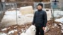 Ge Fangyuan, a farmer in Washington Township, stands with his dog for a portrait at the farm Feb. 20, 2026. Fangyuan's farm was disrupted after a sewer main break dumped about 8,000 gallons of raw sewage in November 2024.