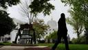 A person walks by a Liberty Bell replica at the Oregon state Capitol on Tuesday, April 14, 2026, in Salem, Ore.