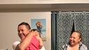 Erasmo Zavala hugs his granddaughter, Selene, as his wife Maria stands nearby. A picture of Selene’s mother, Selena, who was murdered, hangs behind the family. May 29, 2026.