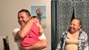 Erasmo Zavala hugs his granddaughter, Selene, as his wife Maria stands nearby. A picture of Selene’s mother, Selena, who was murdered, hangs behind the family. May 29, 2026.
