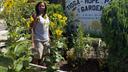 Philadelphia Gardener Estelle Vaughn stands among plants