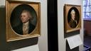 Portraits of a red-headed Thomas Jefferson, left, and John Dickinson, right, by Charles Willson Peale are seen at the refurbished Second Bank of the United States in Philadelphia.
