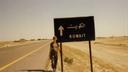 Pennsylvania Treasurer Stacy Garrity, now a candidate for governor, poses near a sign during her military service.