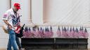 A man and woman in "Trump" hats walk through the Great American State Fair on the National Mall, in Washington.