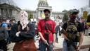 Protesters and militia gathered outside the Capitol in Harrisburg this April for a reopen protest. A recent report by a worldwide nonprofit that tracks militia groups said Pennsylvania is one of five U.S. states at high risk of violence through Nov. 3.