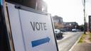 A “vote” sign outside of a polling place.